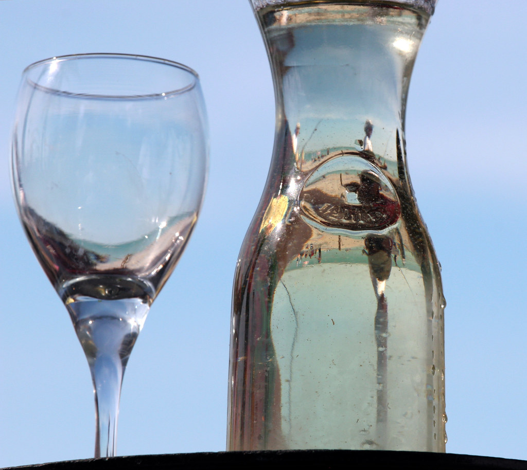 Champagne glasses gleaming under warm light at a celebration